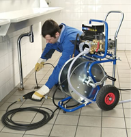 Clearing a commercial bathroom drain with a high-power jetter